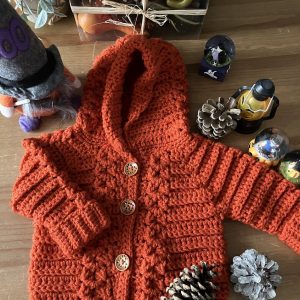 manteau bébé tressé rouge orangé